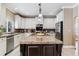 Island kitchen with granite countertops and stainless steel appliances at 24237 E Glasgow Cir, Aurora, CO 80016