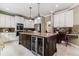 Gourmet kitchen with granite countertops and stainless steel appliances at 24237 E Glasgow Cir, Aurora, CO 80016