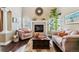 Living room with hardwood floors, fireplace and comfortable seating at 24237 E Glasgow Cir, Aurora, CO 80016