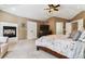 Main bedroom with fireplace, TV, and large walk-in closet at 24237 E Glasgow Cir, Aurora, CO 80016