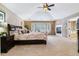 Main bedroom with high ceilings, fireplace, and walk-in closet at 24237 E Glasgow Cir, Aurora, CO 80016