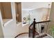 Elegant curved staircase with wrought iron railing overlooking the home's interior at 24237 E Glasgow Cir, Aurora, CO 80016