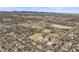 Overhead shot displaying community park and recreational facilities with a backdrop of mountains and city skyline at 9395 W Kentucky Ave, Lakewood, CO 80226