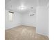 Neutral bedroom with a large window, plush carpet and white walls at 9395 W Kentucky Ave, Lakewood, CO 80226