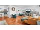 Bright living room featuring hardwood floors, a fireplace, and an open layout at 9395 W Kentucky Ave, Lakewood, CO 80226