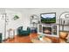 Close-up of a cozy living area with a fireplace and comfortable seating at 9395 W Kentucky Ave, Lakewood, CO 80226
