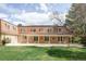 Large backyard with covered patio provides ample outdoor living space at 2209 Green Oaks Ln, Greenwood Village, CO 80121