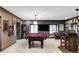 Finished basement with pool table, TV and bar is perfect for entertaining guests at 2209 Green Oaks Ln, Greenwood Village, CO 80121