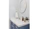 Charming bathroom features tiled countertop and classic wallpaper at 2209 Green Oaks Ln, Greenwood Village, CO 80121