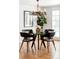 Bright dining area with a glass table, modern chairs, and chandelier with plenty of natural light at 2209 Green Oaks Ln, Greenwood Village, CO 80121