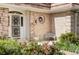 Elegant front entrance with an ornate door and a cozy sitting area at 2209 Green Oaks Ln, Greenwood Village, CO 80121