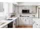 Well-equipped kitchen with modern appliances and bright countertops at 2209 Green Oaks Ln, Greenwood Village, CO 80121