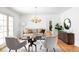 Inviting living room with hardwood floors, stylish furniture, and a chandelier, perfect for relaxation and entertaining at 2209 Green Oaks Ln, Greenwood Village, CO 80121