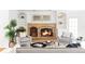 Inviting living room featuring a brick fireplace and comfortable seating at 2209 Green Oaks Ln, Greenwood Village, CO 80121