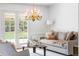 Comfortable living room with ample light featuring a neutral color palette and stylish furnishings at 2209 Green Oaks Ln, Greenwood Village, CO 80121