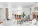 Open-concept living room flows into a modern kitchen with island seating at 2209 Green Oaks Ln, Greenwood Village, CO 80121