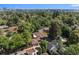 Aerial view of the charming home nestled among mature trees in a quiet neighborhood at 801 S Steele St, Denver, CO 80209