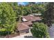 Aerial view of the property highlighting the roof, mature trees, and outdoor patio area at 801 S Steele St, Denver, CO 80209