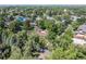 Aerial view of the charming home nestled among mature trees in a quiet neighborhood at 801 S Steele St, Denver, CO 80209