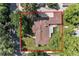 Aerial view of the home showcasing the backyard patio, mature trees, and driveway at 801 S Steele St, Denver, CO 80209