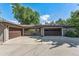Spacious three car garage with adjacent covered patio seating area for outdoor enjoyment at 801 S Steele St, Denver, CO 80209