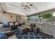 The covered patio offers comfortable seating, a ceiling fan, and a cozy atmosphere for outdoor gatherings at 801 S Steele St, Denver, CO 80209