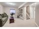 Finished basement with living area, exercise equipment, and built-in shelving at 2676 S Troy Ct, Aurora, CO 80014