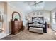 Spacious Primary bedroom with king-size bed and ensuite bathroom at 2676 S Troy Ct, Aurora, CO 80014