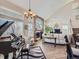 Well-lit living room with a fireplace, piano, and modern furnishings at 2676 S Troy Ct, Aurora, CO 80014