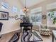 Living room with a piano, natural light, and vaulted ceilings at 2676 S Troy Ct, Aurora, CO 80014