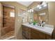 Modern bathroom features a dual sink vanity and glass block window at 27341 Ridge Trl, Conifer, CO 80433