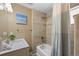 Well-lit bathroom with a tub/shower combo, modern sink, and neutral tiled walls at 27341 Ridge Trl, Conifer, CO 80433