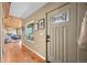 Entryway featuring hardwood floors, stained glass door and open floor plan at 27341 Ridge Trl, Conifer, CO 80433