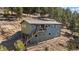 Two-story home with multi-level decks and landscaping at 27341 Ridge Trl, Conifer, CO 80433