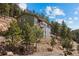 Attractive home on a hillside lot with tiered levels, offering privacy and scenic views at 27341 Ridge Trl, Conifer, CO 80433