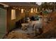 Charming patio with string lights, outdoor furniture, and a grill, providing a cozy outdoor living space at 27341 Ridge Trl, Conifer, CO 80433