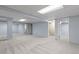 Spacious basement featuring neutral carpet, light blue walls, and multiple rooms at 3720 S Fairplay Way, Aurora, CO 80014