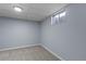 Cozy basement bedroom with carpet, light blue walls, and window at 3720 S Fairplay Way, Aurora, CO 80014