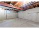 Unfinished basement featuring concrete walls and exposed ceiling at 3720 S Fairplay Way, Aurora, CO 80014