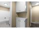 Cozy bathroom featuring a toilet, shower with white tiles, and a white storage cabinet at 3720 S Fairplay Way, Aurora, CO 80014