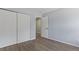 A cozy bedroom boasts wood floors, a closet, and a bright window for natural light at 3720 S Fairplay Way, Aurora, CO 80014