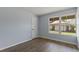 Bright bedroom with natural lighting and wood floors showcases an airy and inviting space at 3720 S Fairplay Way, Aurora, CO 80014