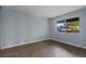 A tidy bedroom features wood floors and a large window for ample sunlight at 3720 S Fairplay Way, Aurora, CO 80014