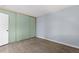 A clean, empty bedroom shows hardwood floors and a large closet for ample storage at 3720 S Fairplay Way, Aurora, CO 80014