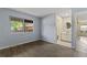 A spacious bedroom with wood-look flooring and an attached bathroom, offering comfort and convenience at 3720 S Fairplay Way, Aurora, CO 80014