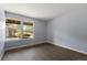 An inviting bedroom features wood floors and a view of the outdoors at 3720 S Fairplay Way, Aurora, CO 80014