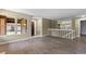 Bright living area showcasing wood floors, large windows, and a welcoming entrance at 3720 S Fairplay Way, Aurora, CO 80014