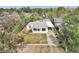 Aerial view of a well-kept single-story home with yard and long driveway at 7760 Magnolia St, Commerce City, CO 80022