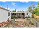 Aerial view of backyard featuring a metal stock tank and covered patio at 7760 Magnolia St, Commerce City, CO 80022