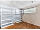 Basement rec room featuring bright lighting and built-in shelving at 7760 Magnolia St, Commerce City, CO 80022